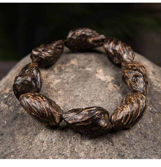 Agarwood Bracelet made from Dalagang tree core knot, freeform shape, rich medicinal fragrance, deep heritage. A wooden craft piece, a perfect gift, and a unique bracelet